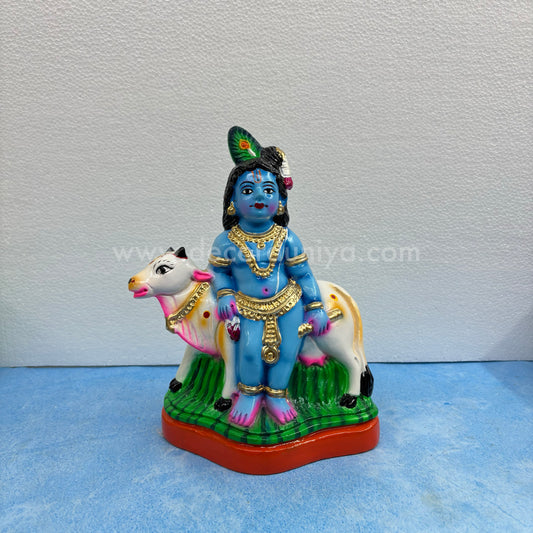 Cow Krishna paper mache golu doll – handmade Balakrishna idol with cow for Navaratri display