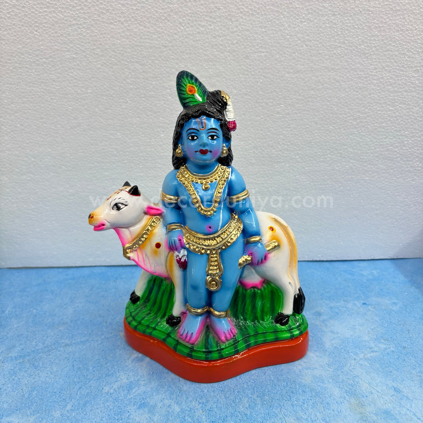 Cow Krishna paper mache golu doll – handmade Balakrishna idol with cow for Navaratri display