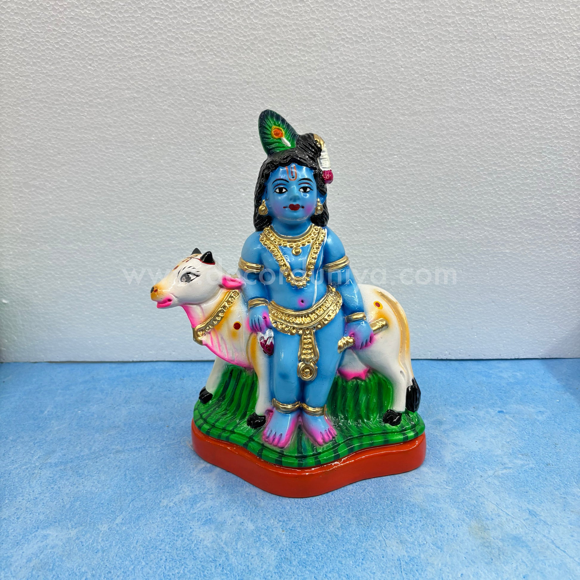 Cow Krishna paper mache golu doll – handmade Balakrishna idol with cow for Navaratri display