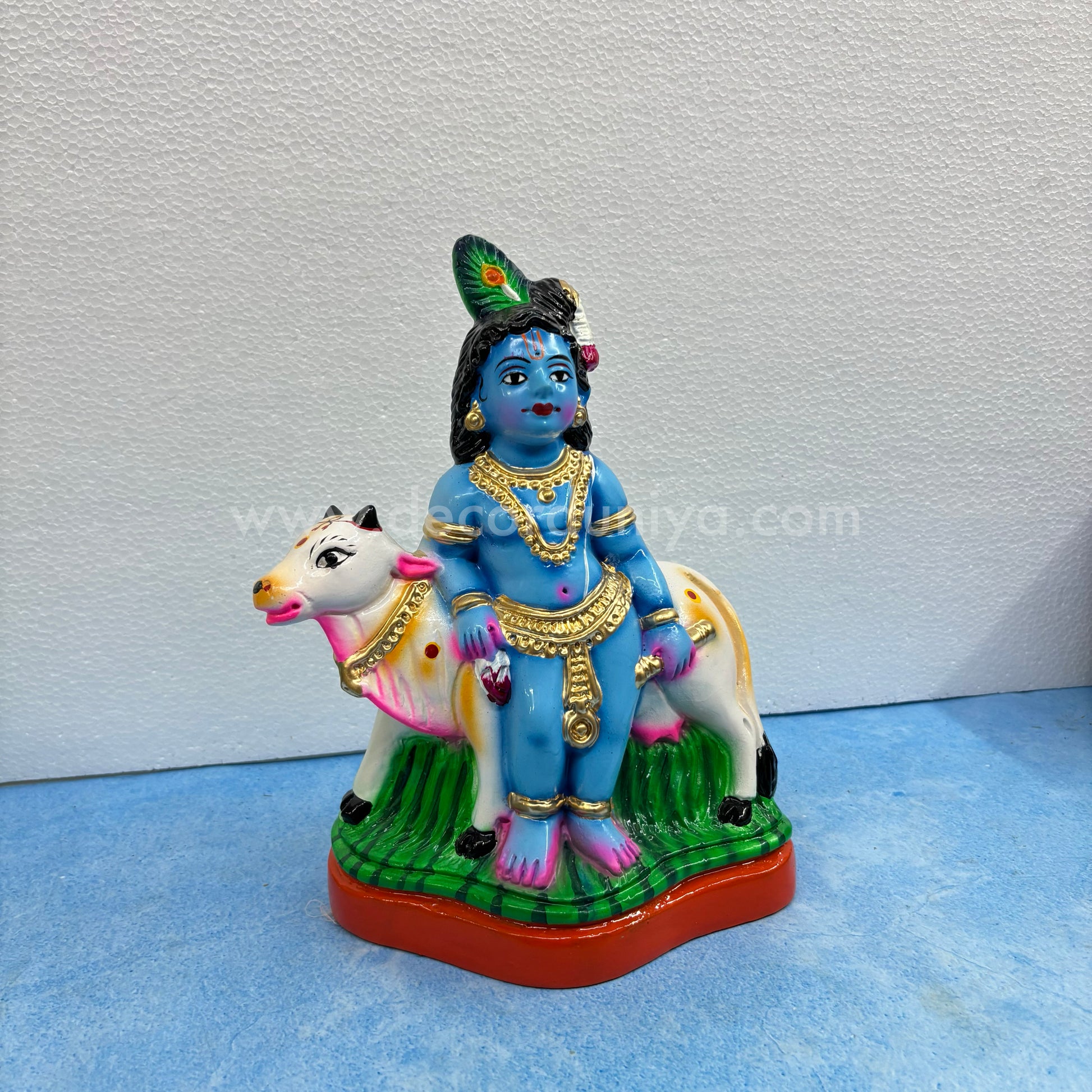 Cow Krishna paper mache golu doll – handmade Balakrishna idol with cow for Navaratri display
