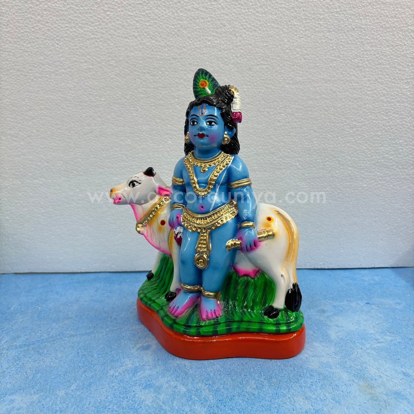 Cow Krishna paper mache golu doll – handmade Balakrishna idol with cow for Navaratri display